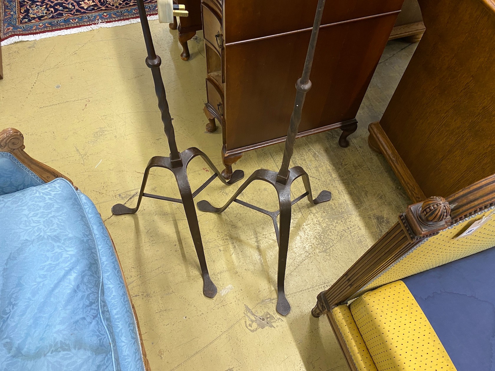 A pair of wrought iron floor lamps, height 160cm